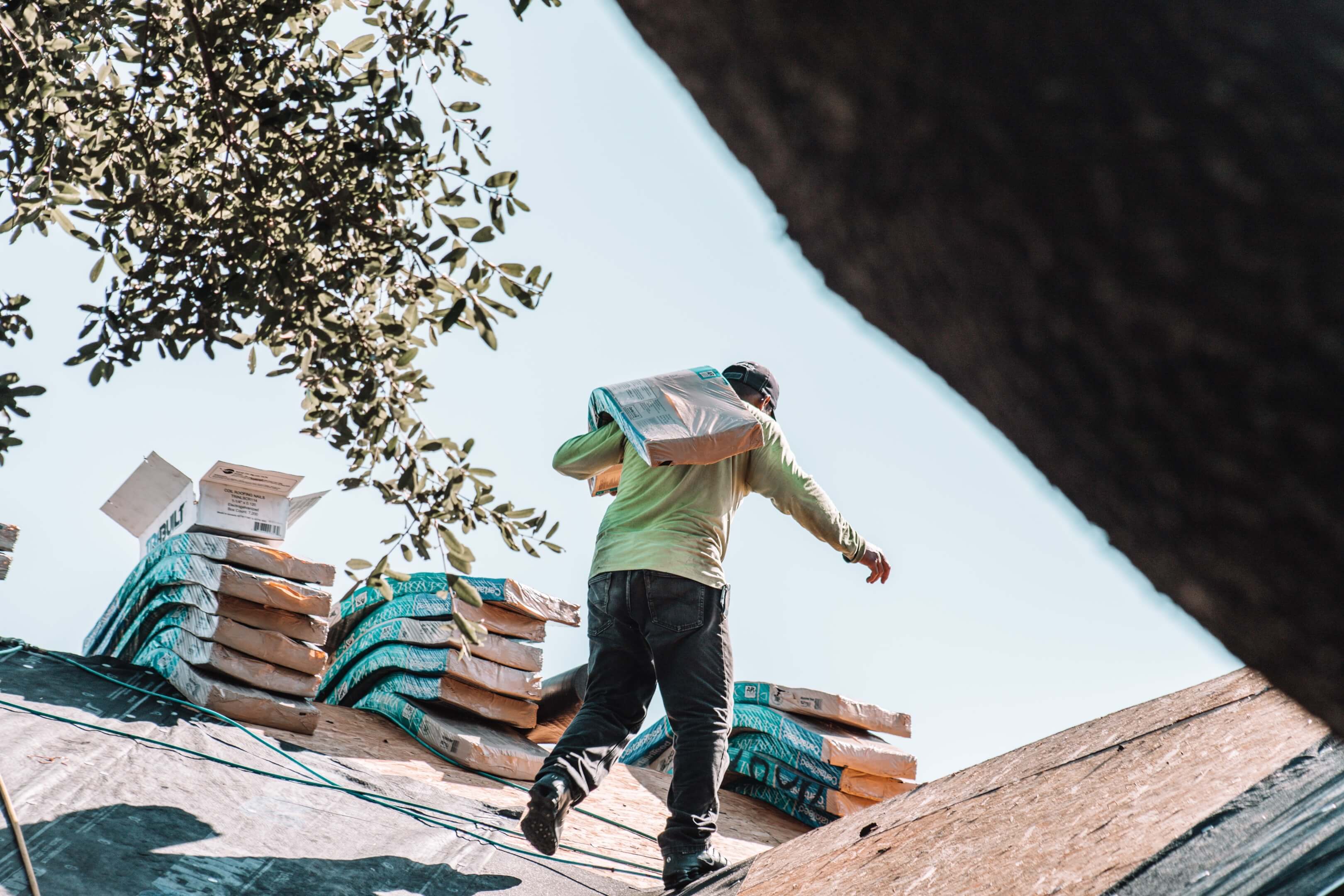 roofer carrying shingles